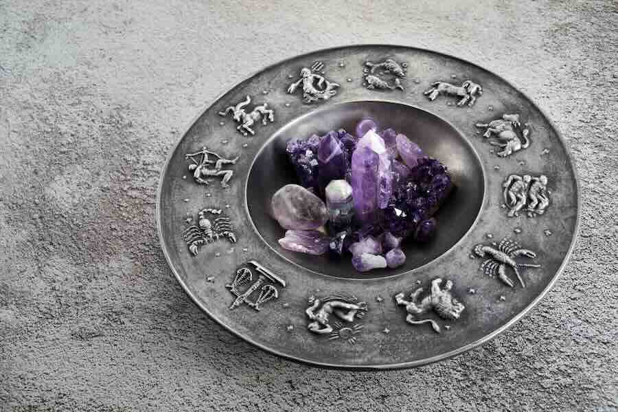 Crystals for healing, fortune telling and astrology circle on grey background. Esoteric and life coaching concept